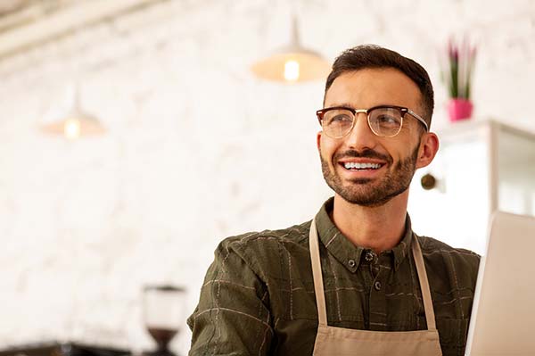 Person working at a cash register at a restaurant