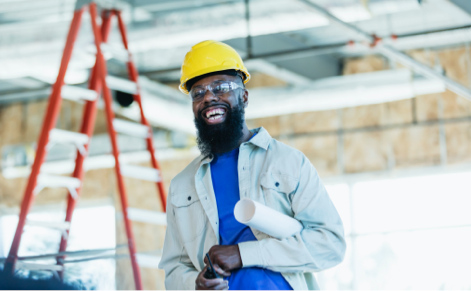 worker holding blueprints