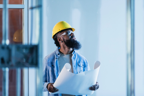 construction worker with blueprints