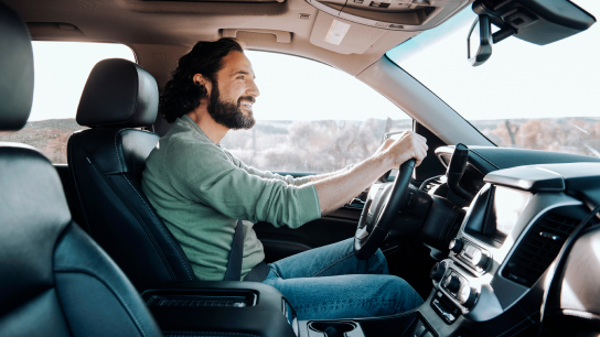 Man in a car driving